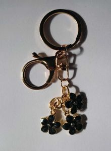 Hovedbilde Veskepynt Blomster Sort